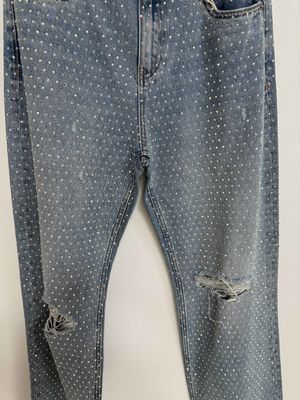 Ornamentações em pedra de strass da moda Jeans cortados para chamar a atenção